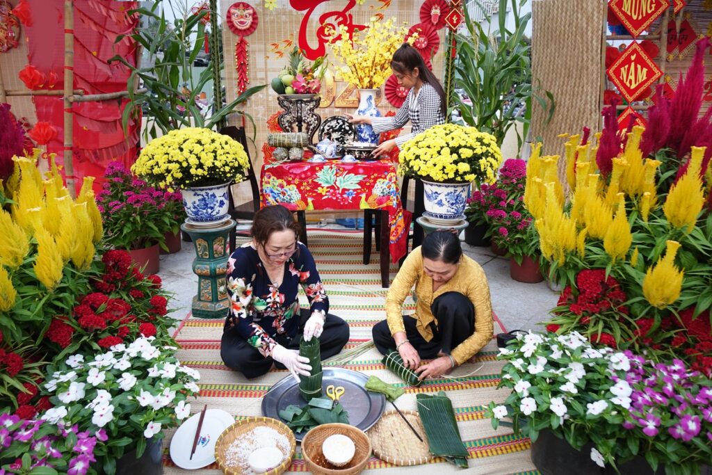 Colorful Vietnamese New Year celebration with traditional food and decorations.